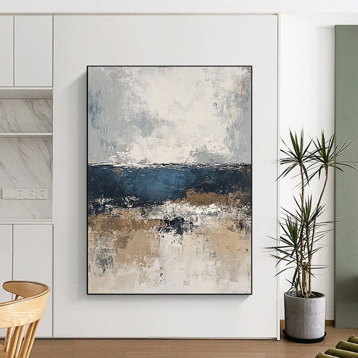 Large abstract painting of the sea in gray and blue tones with accents of beige brown and white for a serene artistic touch.STSC343