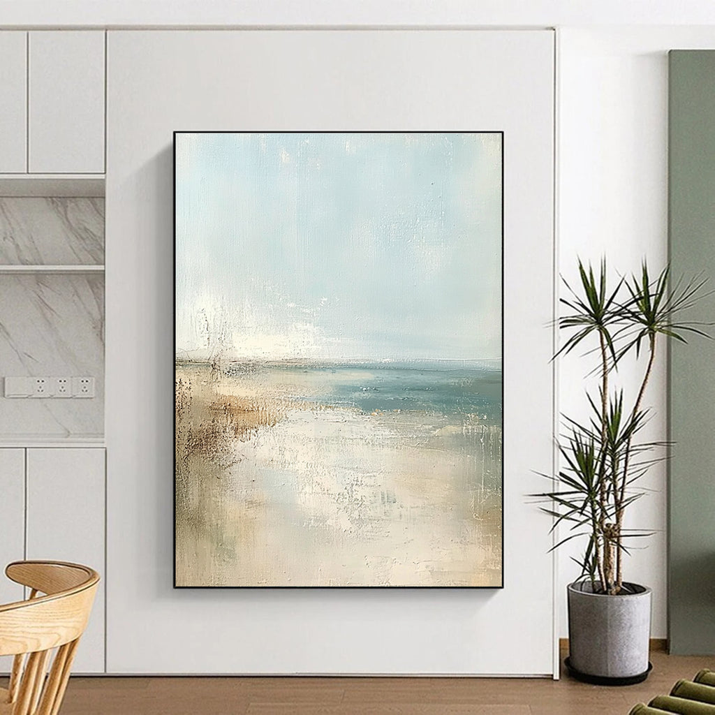 Large abstract painting of a beach in soft pastel colors featuring a light blue sky and neutral tones for a serene atmosphere.STSC158
