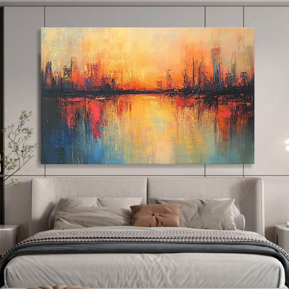 Large abstract painting featuring a cityscape in warm hues with soft brush strokes and reflections on calm waters, evoking a serene sunrise atmosphere.SC037