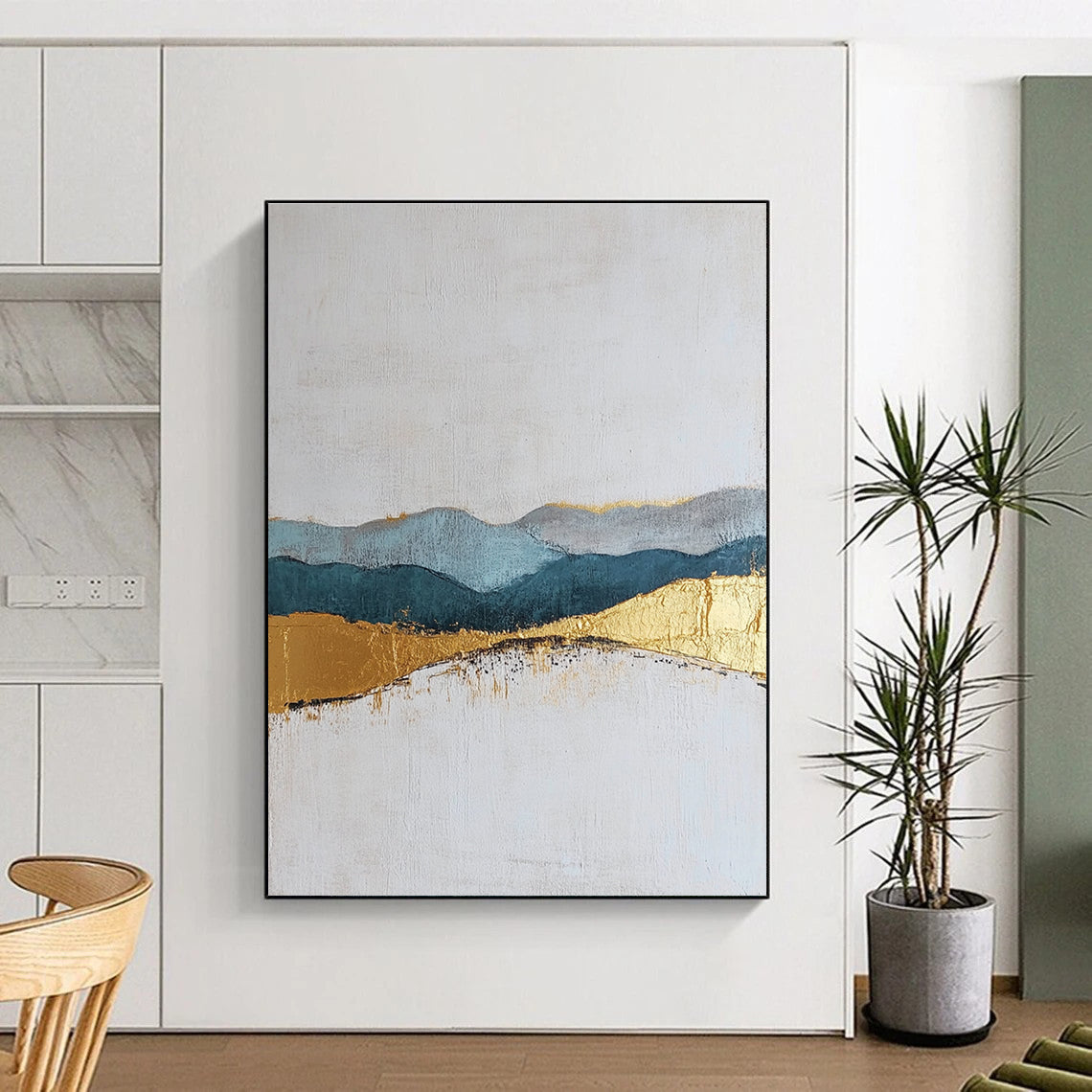 Large abstract painting featuring textured layers in neutral colors with elegant gold and blue accents for a sophisticated decor.STSC110