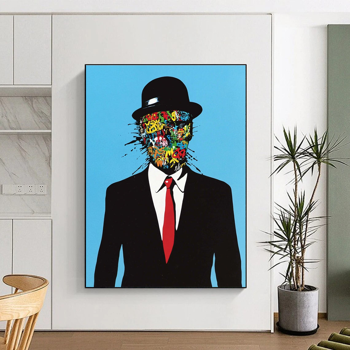 An abstract artwork featuring a man in a black suit and red tie with graffiti on his face against a blue background in a surreal style.STSC1056