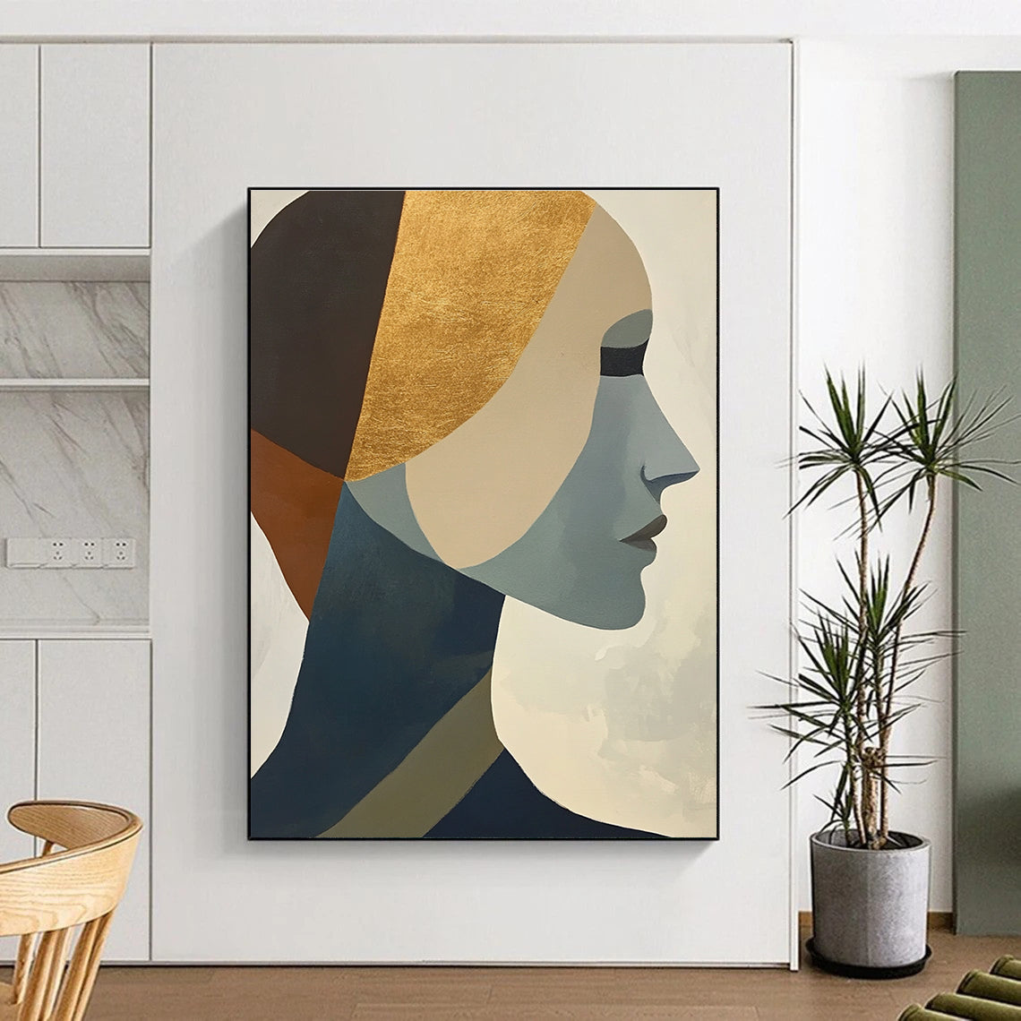Large abstract painting featuring cubist shapes and lines muted colors gold foil accents and a hint of the female form.STSC692