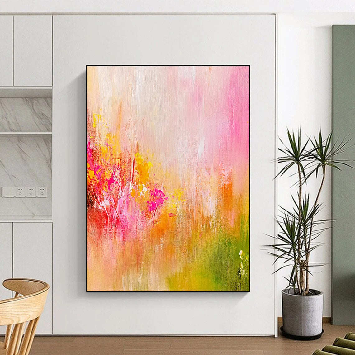 Large abstract painting in soft pink and yellow tones with delicate brushstrokes and a vibrant background evoking a romantic dreamy atmosphere.STSC489