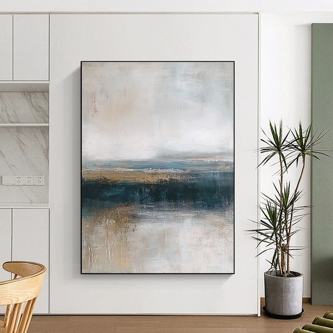 Large abstract painting depicting textured ocean waves in blue and gray with a soft beige sky and earthy shore tones for a tranquil ambiance.STSC463