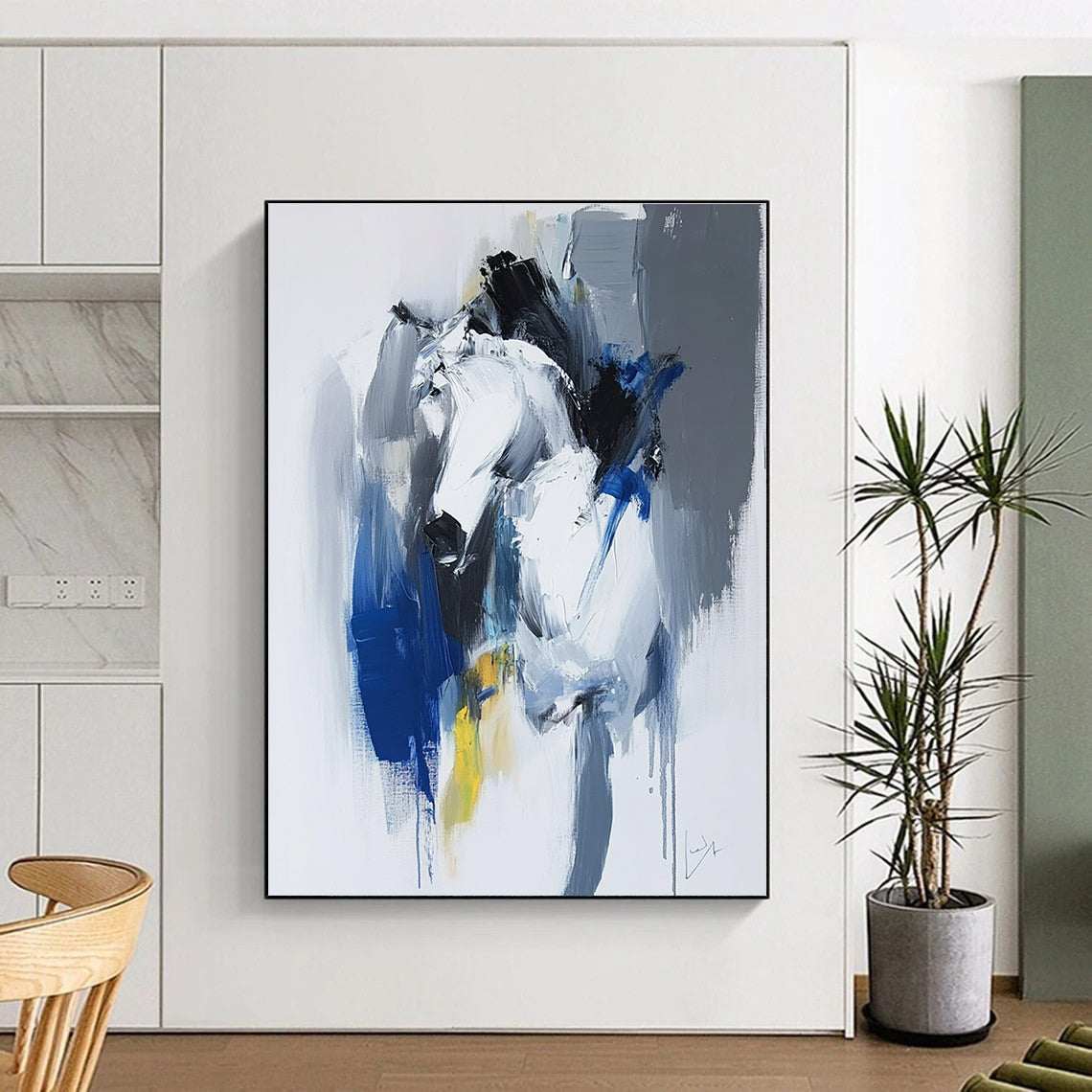 Large abstract painting in blue and white with dynamic brushstrokes reveals movement and emotion featuring elements of strength and energy.STSC036