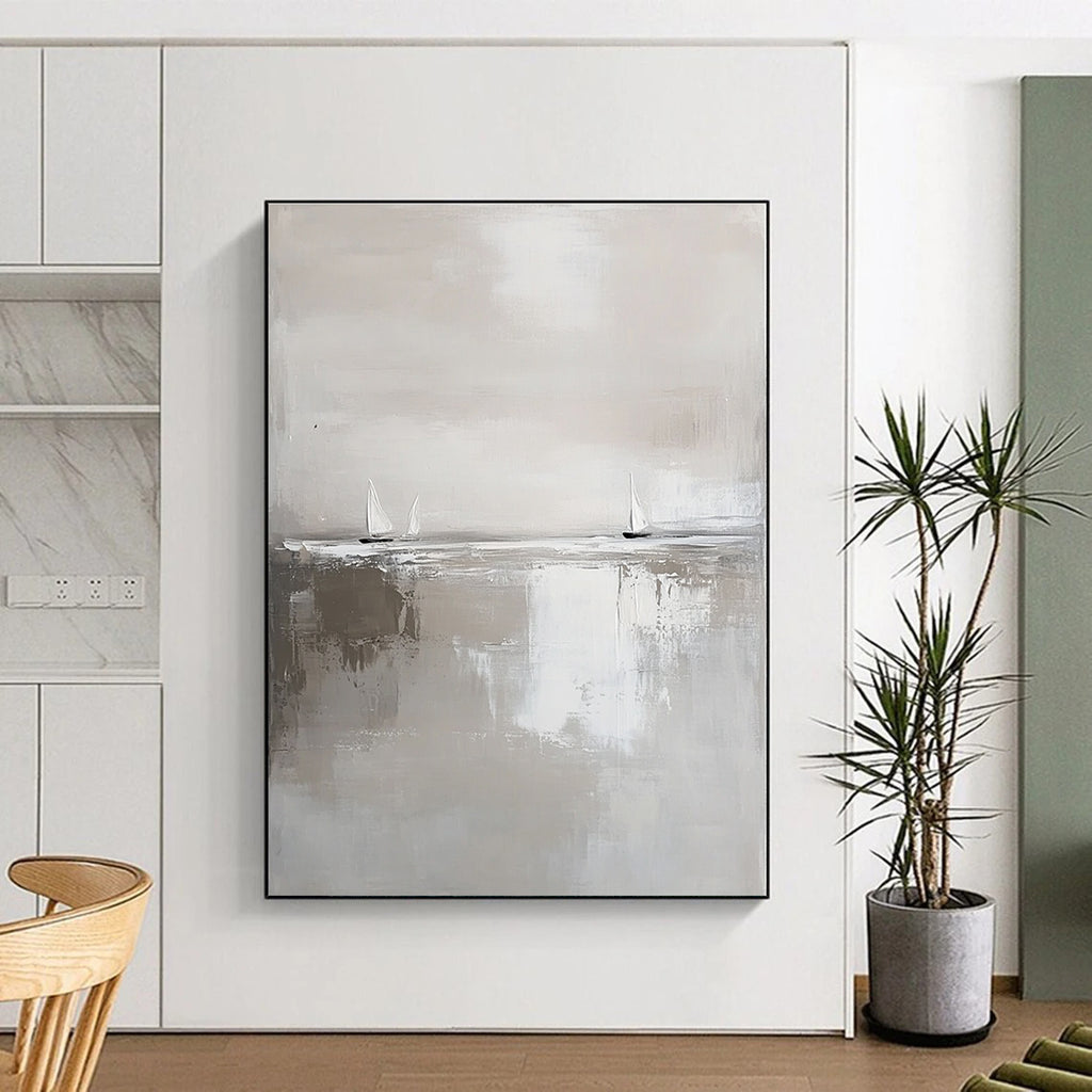 Large abstract painting in white and gray featuring calm waters and distant sailboats in a minimalist style with neutral tones.STSC359