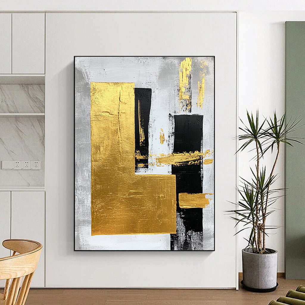 Large abstract art painting featuring gold foil bold strokes and minimalist black lines on a gray background creating an elegant atmosphere.STSC015