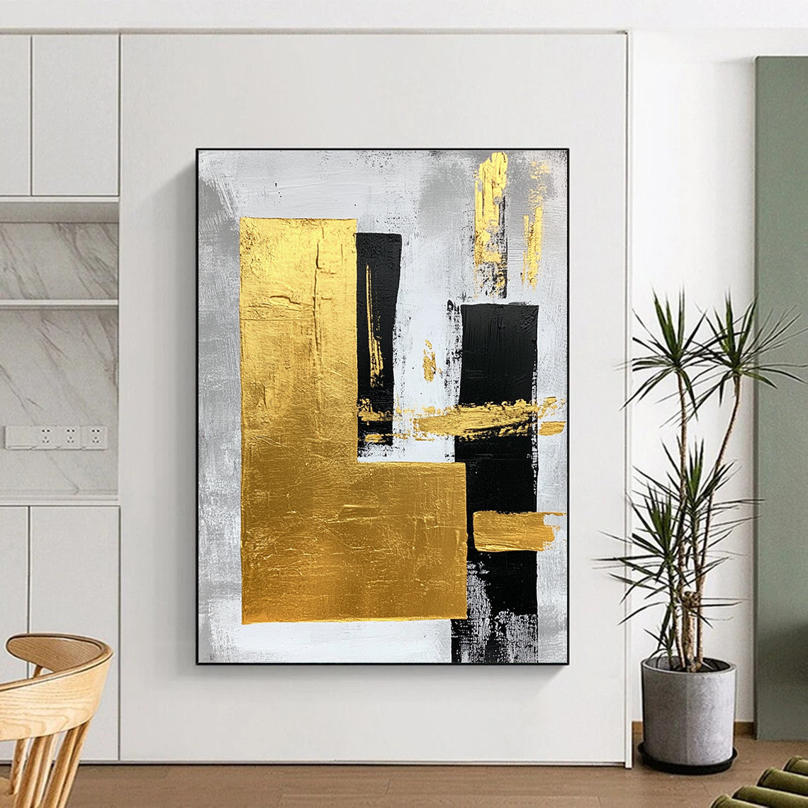 Large abstract art painting featuring gold foil bold strokes and minimalist black lines on a gray background creating an elegant atmosphere.STSC015