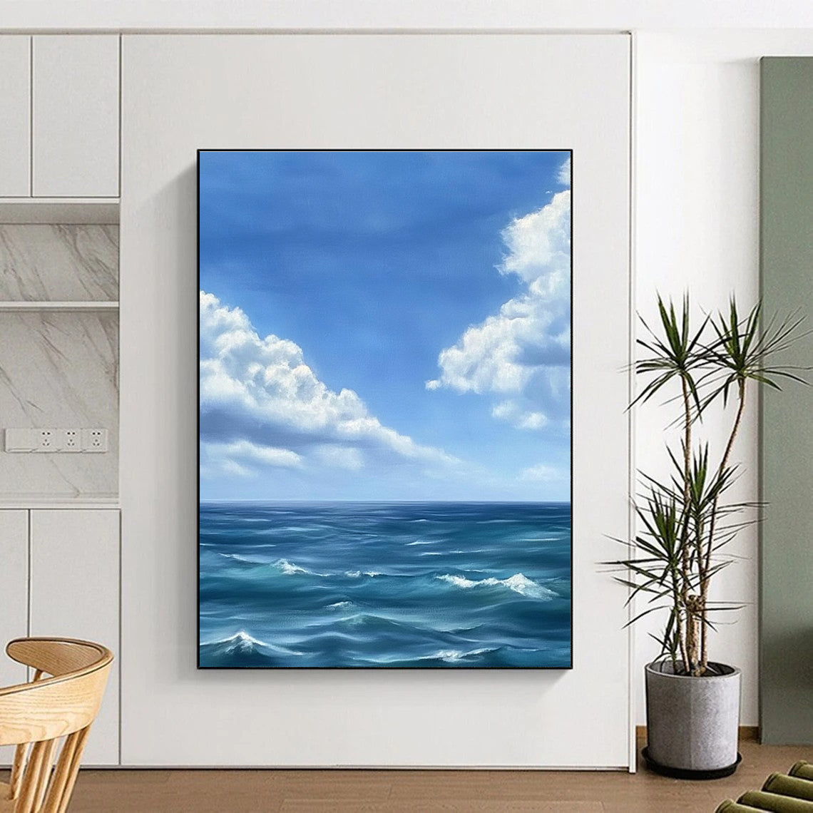 Large abstract painting depicting a tranquil ocean scene with gentle waves under a vast blue sky and soft white clouds in Monet's style.STSC1215