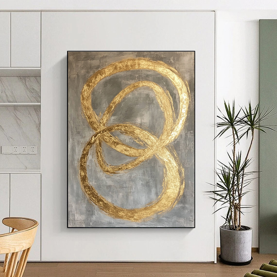 Large abstract painting featuring intertwined O-shapes in gold leaf on a modern grey background.STSC1295