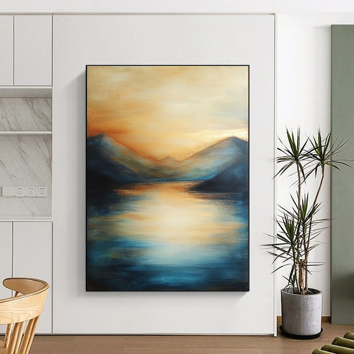 Large abstract painting of the sea featuring soft brush strokes with blue tones and golden accents creating a serene sunset atmosphere.STSC092